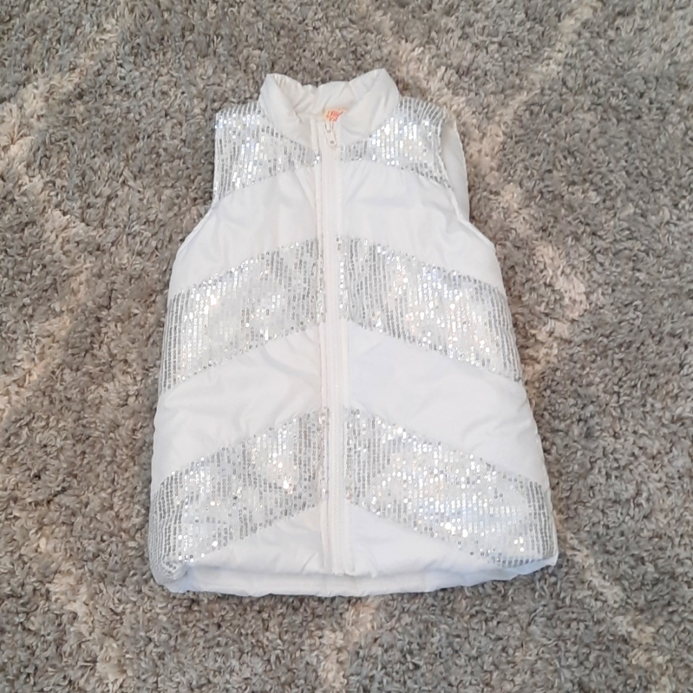 A white vest with grey sequence from faded glory